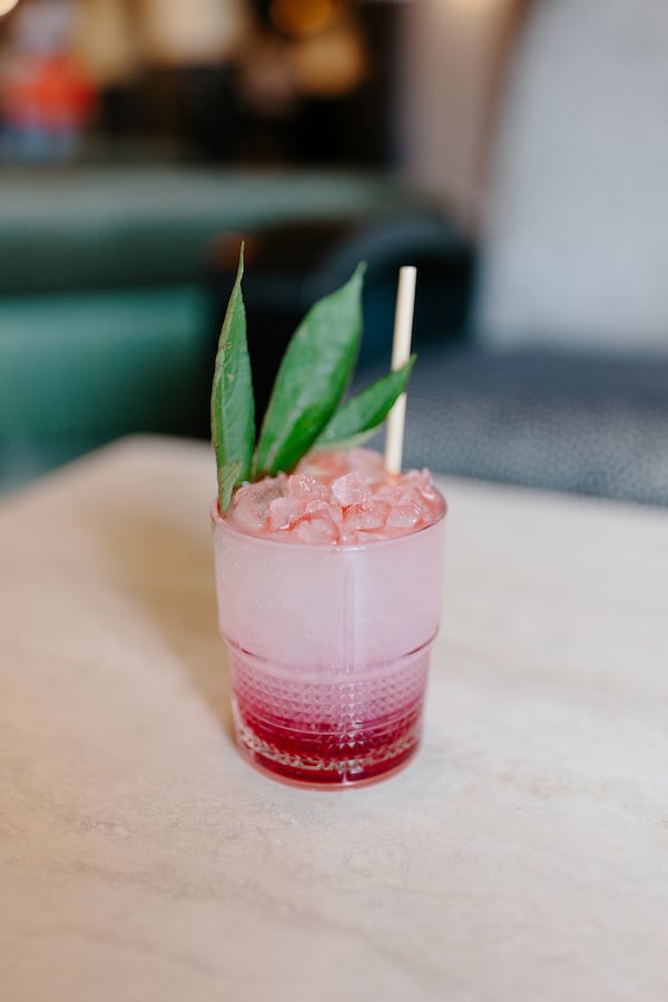 A pink riff on an aviation, Atrium's roselle is perfumed and flavored with hibiscus and elderflower, complementing the floral interiors. Courtesy of Oliva Restaurant Group