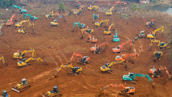 Heavy equipment works at a construction site for a field hospital in Wuhan in central China's Hubei Province.