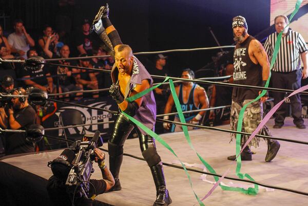 Ring of Honor wrestler Matt Taven (real name Matthew Marinelli) boasts directly to the camera while holding his world champion belt high. He performed in 3-on-3 match that was part of a show by wrestling promotion Ring of Honor on Saturday, Aug. 24, 2019 at Center Stage Theater in Atlanta. (Ben Brasch/AJC)