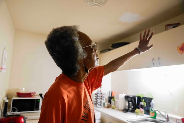 Bernadine Gibson, 82, talks about leaks in her kitching ceiling and how she is looking forward to renovations to the building her family has lived in for 27 years, Monday, Nov. 18, 2024, in Chicago. (AP Photo/Erin Hooley)