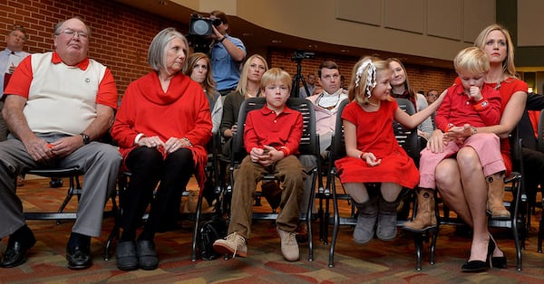 Sonny Smart (left) attends son Kirby’s 2015 introductory news conference in Athens with his wife, Sharon. Also pictured: Kirby Smart’s children Weston, Julia and Andrew, and his wife, Mary Beth. (Brant Sanderlin/AJC)