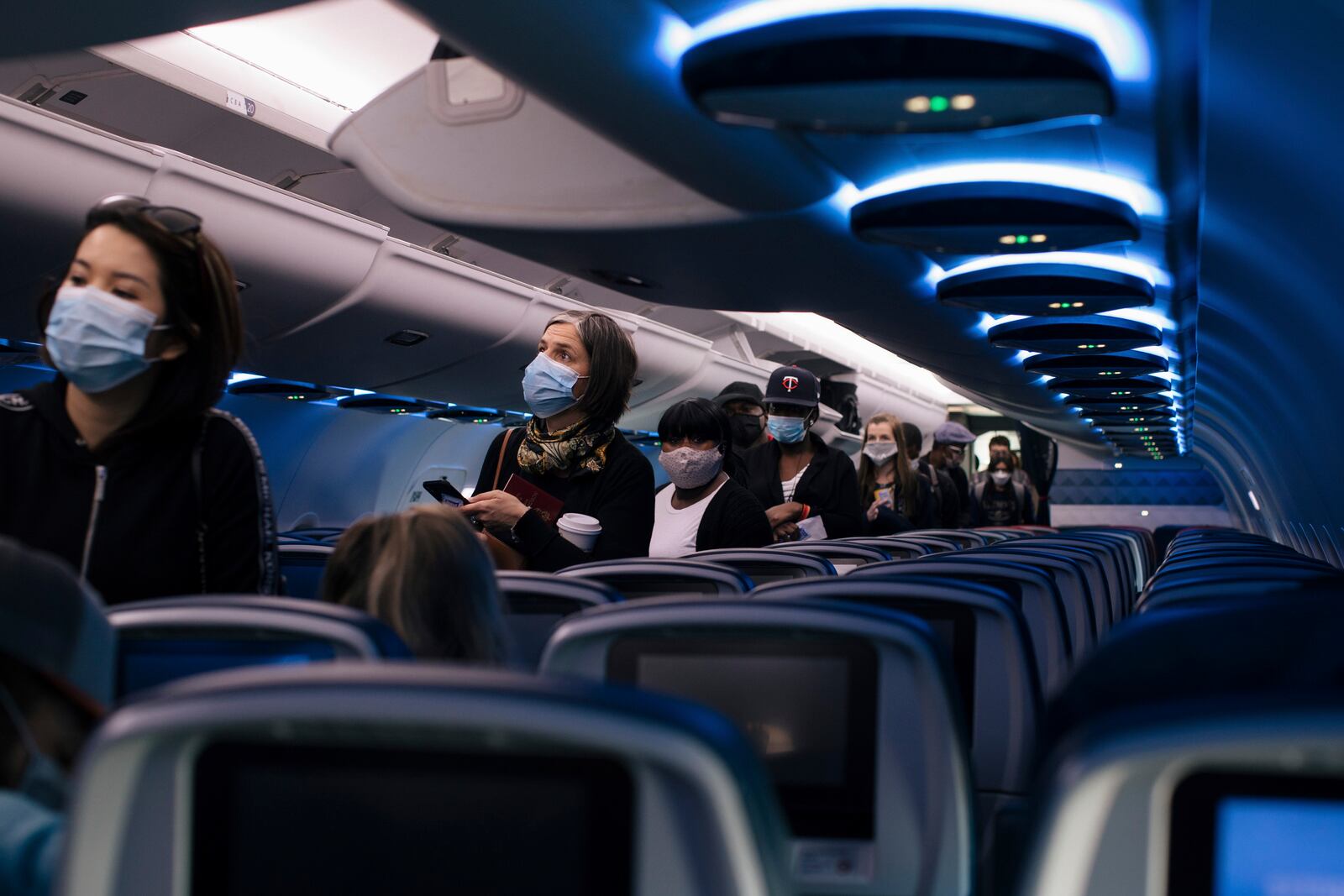 Passengers board a Delta Air Lines flight at Baltimore-Washington International Airport, June 1, 2020. (Alyssa Schukar/The New York Times).