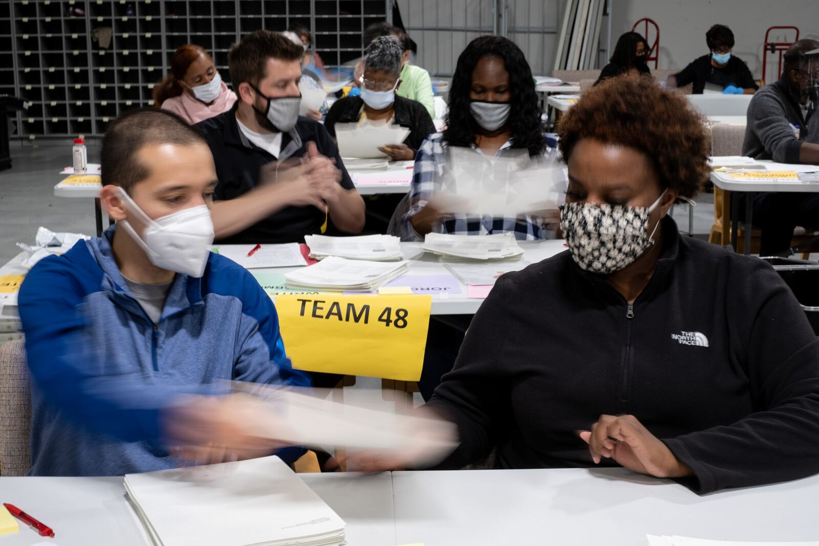 Workers recount ballots at the Gwinnett County election warehouse in Lawrenceville on Nov. 16, 2020. (Ben Gray for the Atlanta Journal-Constitution)