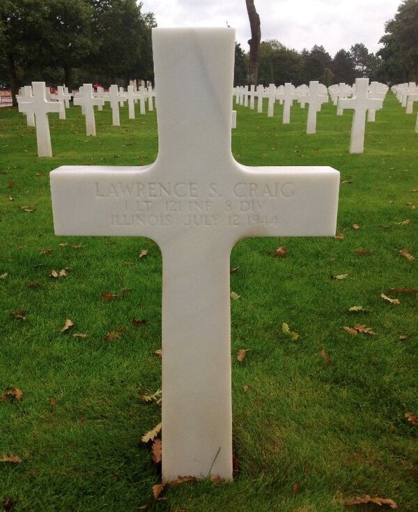 A Christian cross decorates the grave of 1st Lt. Lawrence Samuel Craig, who is buried  in the Normandy American Cemetery. This weekend volunteers will replace the cross with an appropriate marker. Courtesy of Bill Loventhal