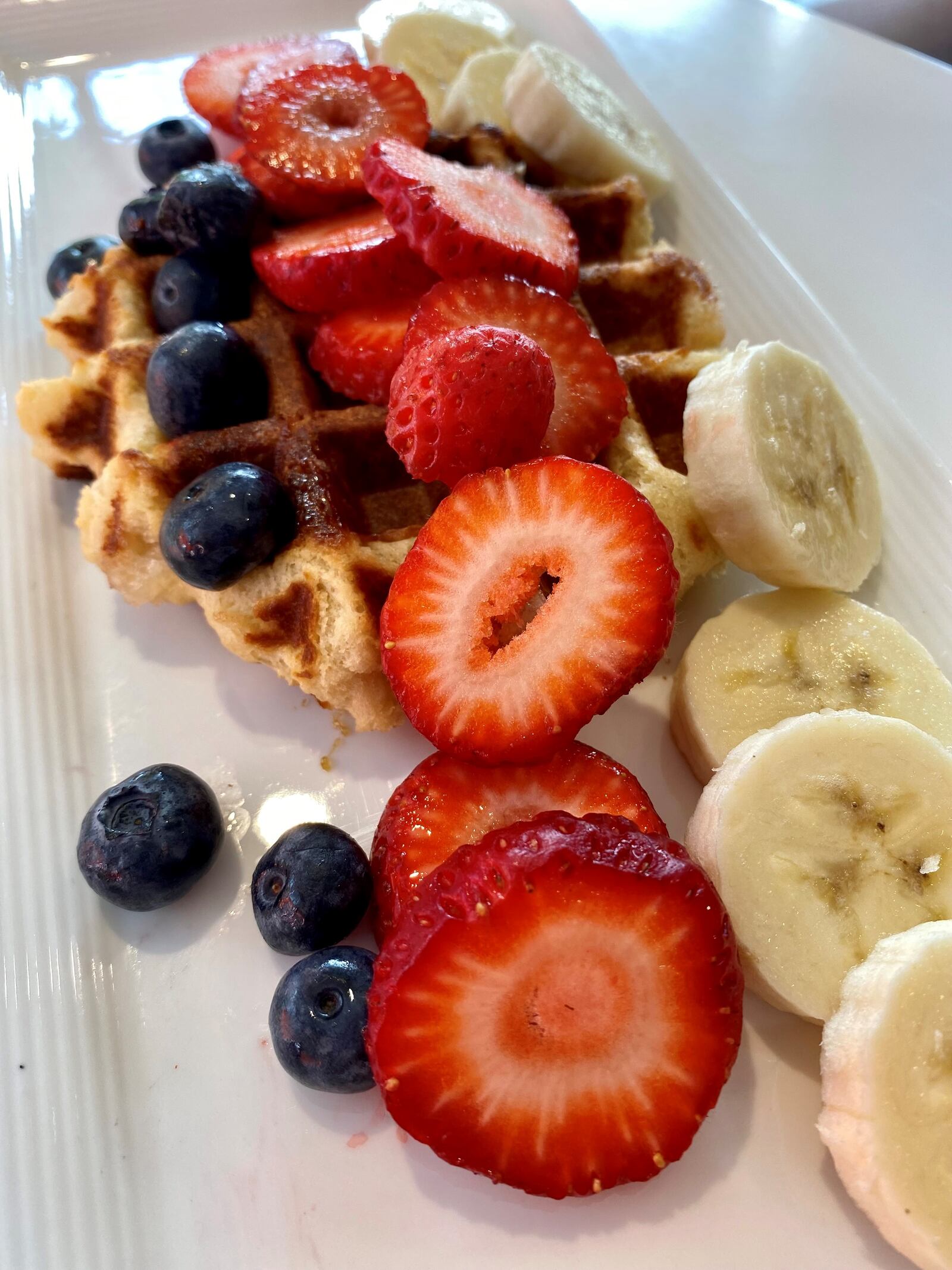 Besties’ liege-style Belgian waffles are sprinkled with pearl sugar and are delicious plain, or with fruit. Courtesy of Carina Balonchard