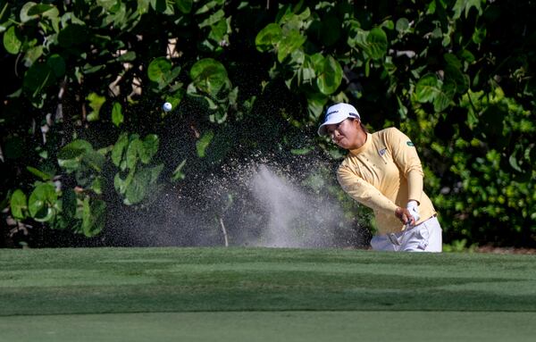 Mao Saigo hits from the sand on the sixth hole during the first round of the CME Group Tour Championship LPGA Tour golf tournament Thursday, Nov. 21, 2024, in Naples, Fla. (AP Photo/Chris Tilley)