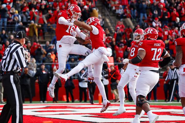 Rutgers quarterback Athan Kaliakmanis (16) celebrates his rushing touchdown against Illinois with wide receiver Dymere Miller (0) during the first half of an NCAA college football game, Saturday, Nov. 23, 2024, in Piscataway, N.J. (AP Photo/Rich Schultz)