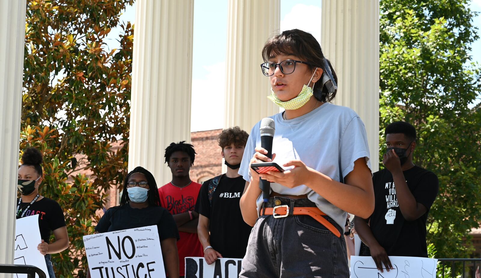 June 19, 2020 Madison - Lipi Desai, 17, speaks as residents gather at the Town Park in downtown Madison before a peaceful, youth-led march on Friday, June 19, 2020. As protests in response to the death of George Floyd spread nationwide earlier this month, they started to pop up in some unexpected places: namely, the Atlanta exurbs, places like Cartersville, Peachtree City, Forsyth County, Braselton and Madison -- the predominantly white town about an hour east on I-20, whose main street is still lined with antebellum homes that Gen. Sherman purportedly found too beautiful to burn. (Hyosub Shin / Hyosub.Shin@ajc.com)