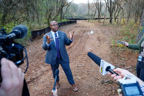 Marshall Freeman, the chief administrative officer for the Atlanta Police Department, updated members of the press about the 0.9-mile walking trail under construction at the Atlanta Police Safety Training Center, during a media tour on Tuesday, Dec. 17, 2024. (Miguel Martinez/AJC)