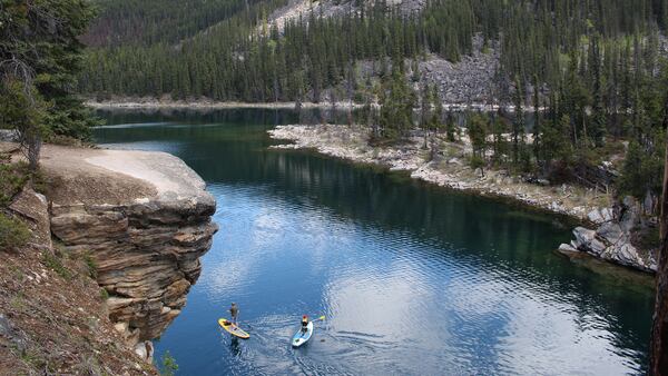 Horseshoe Lake, a favorite of swimmers who sometimes dive off its rocky outcrops, also draws a variety of paddlers to its placid waters. (Alan Solomon/Chicago Tribune/TNS)