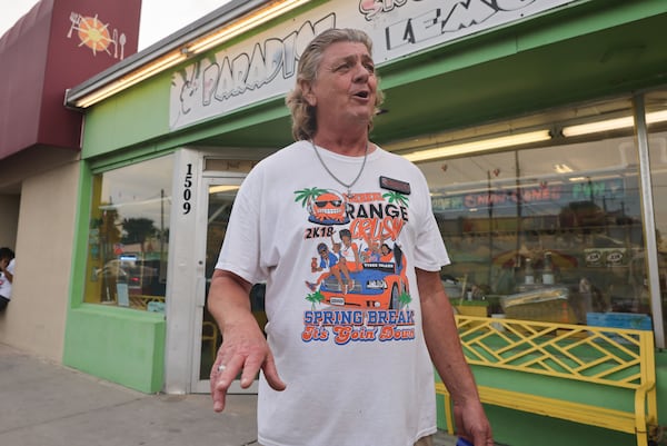 Mark Balance, Owner of Paradise Snowcones and Fresh Squeezed Lemonade in Tybee Island wears an Orange Crush shirt from 2018 on Saturday, April 20, 2024. (Natrice Miller/AJC)