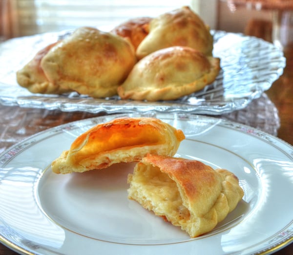 In Bolivia, a cheese empanada can serve as a lunch or a snack. STYLING BY LESLY SOBEL / CONTRIBUTED BY CHRIS HUNT PHOTOGRAPHY