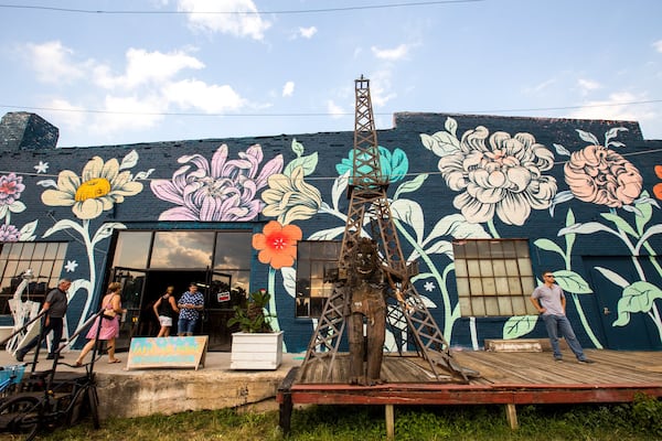 The Eastside Beltline benefits from projects like the OuterSpace series, which produced this mural by Detroit-based artist Ouizi at Paris on Ponce. The Beltline is continuing to evolve with new art installations, murals and sculptures. (Jenni Girtman/Atlanta Event Photography)