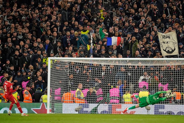 PSG's goalkeeper Gianluigi Donnarumma saves a penalty from Liverpool's Darwin Nunez during a shootout at the end of the Champions League round of 16 second leg soccer match between Liverpool and Paris Saint-Germain at Anfield in Liverpool, England, Tuesday, March 11, 2025. (AP Photo/Dave Thompson)