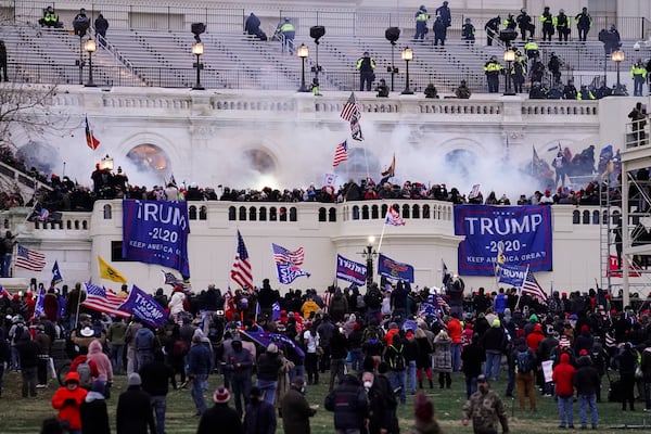 FILE - Violent rioters, loyal to President Donald Trump, storm the Capitol in Washington, Jan. 6, 2021. (AP Photo/John Minchillo, File)