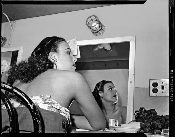 "Lena Horne reflected in mirror in dressing room at Stanley Theatre" (circa 1944) is included in the exhibit "Teenie Harris, Photographer: An American Story" at the Atlanta University Center's Robert W. Woodruff Library.