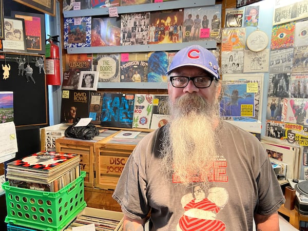 Jim Wilson, the co-owner of North Street Records in Uptown Normal, poses inside his record shop, which he's helped operate for 18 years.