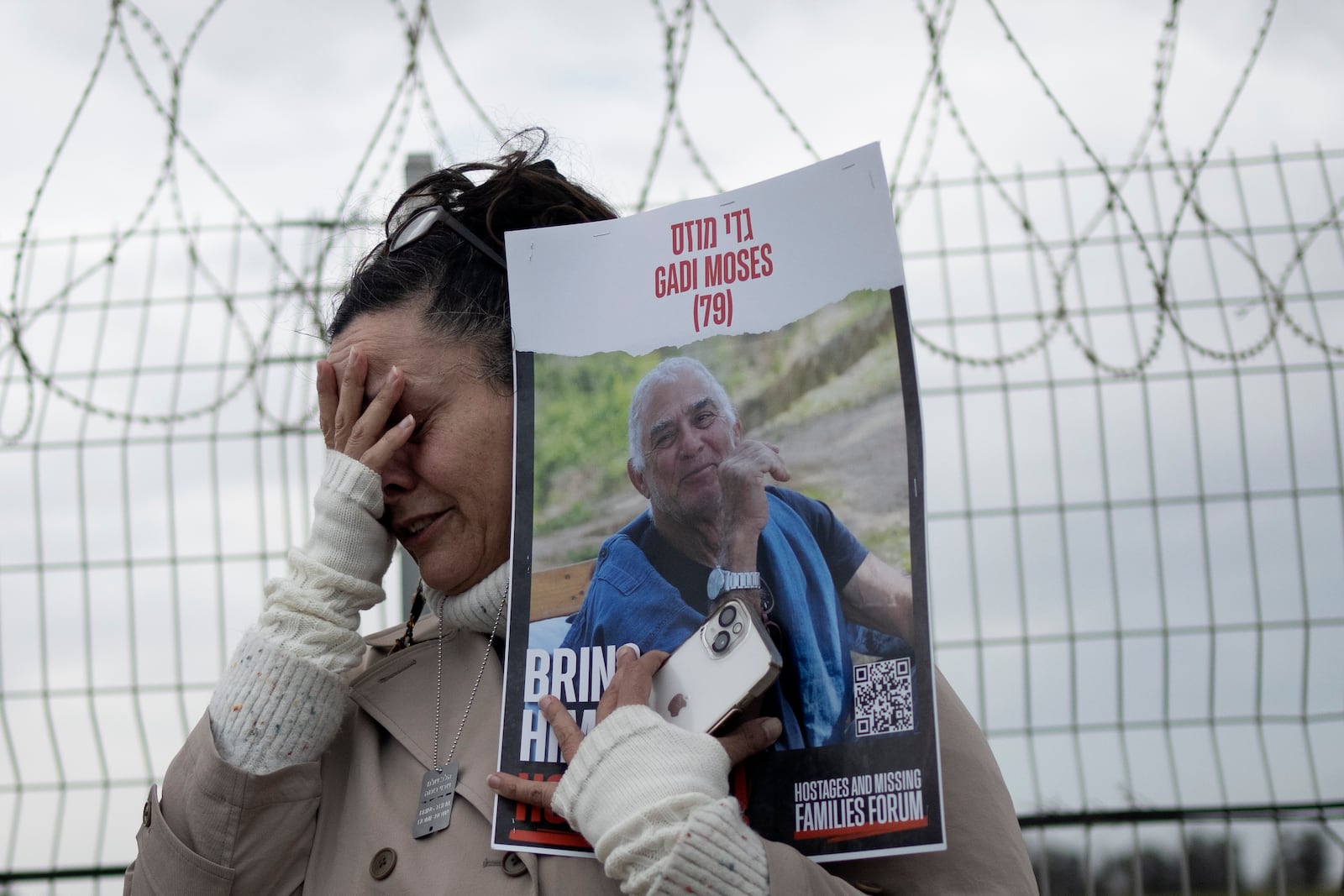 FILE - Efrat Machikawa, whose uncle, Gadi Moses is in Hamas captivity in the Gaza Strip since his capture from Kibbutz Nir Oz on Oct. 7, reacts at the Gaza border in Kibbutz Nirim, southern Israel, on Jan. 11, 2024. (AP Photo/Maya Alleruzzo)