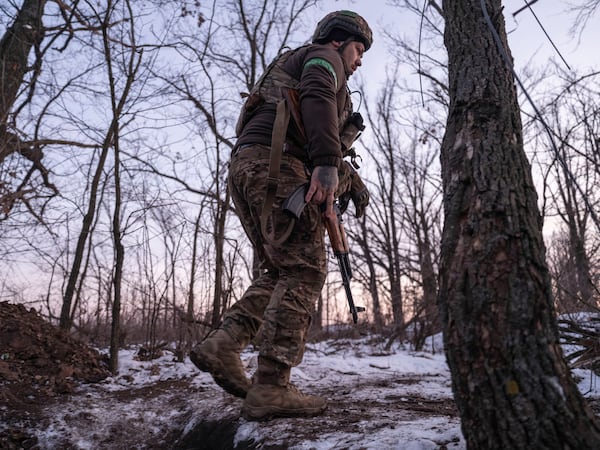 In this photo provided by Ukraine's 93rd Mechanized Brigade press service, a Ukrainian soldier passes by in partially occupied Toretsk, the site of heavy battles with the Russian troops in the Donetsk region, Ukraine, Saturday, Feb. 22, 2025. (Iryna Rybakova/Ukraine's 93rd Mechanized Brigade via AP)