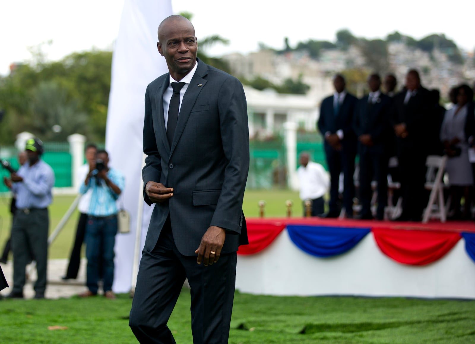 Haiti's President Jovenel Moise attends a ceremony in Port-au-Prince, Haiti, Friday, Jan. 12, 2018. Haitians reacted with outrage Friday to reports that President Donald Trump questioned why the U.S. would accept more immigrants from Haiti and "shithole countries" in Africa at an Oval Office meeting held on the eve of the anniversary of the 2010 earthquake. Moise's government issued a strongly worded statement denouncing what it called a "racist" view of Haitian immigrants and people from African countries. (AP Photo/Dieu Nalio Chery)