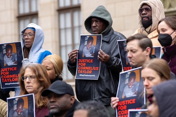 Family members and activists protest the death of Cornelius Taylor, a homeless man killed when the city cleared an encampment last week, in front of City Hall in Atlanta on Jan. 23. (Arvin Temkar/AJC)