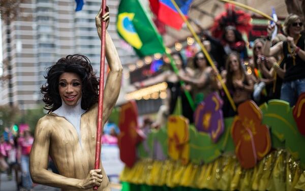 Titus Davis marches in the Atlanta Pride Parade on Peachtree Street, Sunday, Oct. 11, 2015. This Sunday, the Atlanta Equality March will celebrate Pride Month in Atlanta.