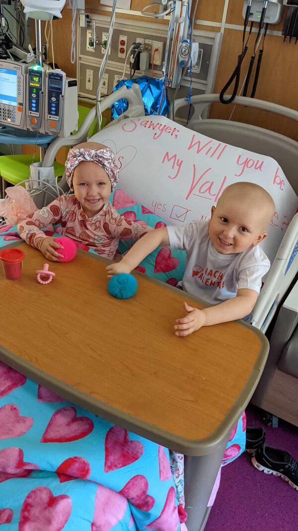 Sawyer Vines and Levi Lansdell, both age 3 in this photo taken in February, at Children's Healthcare of Atlanta Hospital. The two became best friends, and their parents also formed a close friendship, during their long hospital stay for cancer treatments. Both children are now out of the hospital and their cancer is in remission. Photo courtesy of CURE Childhood Cancer