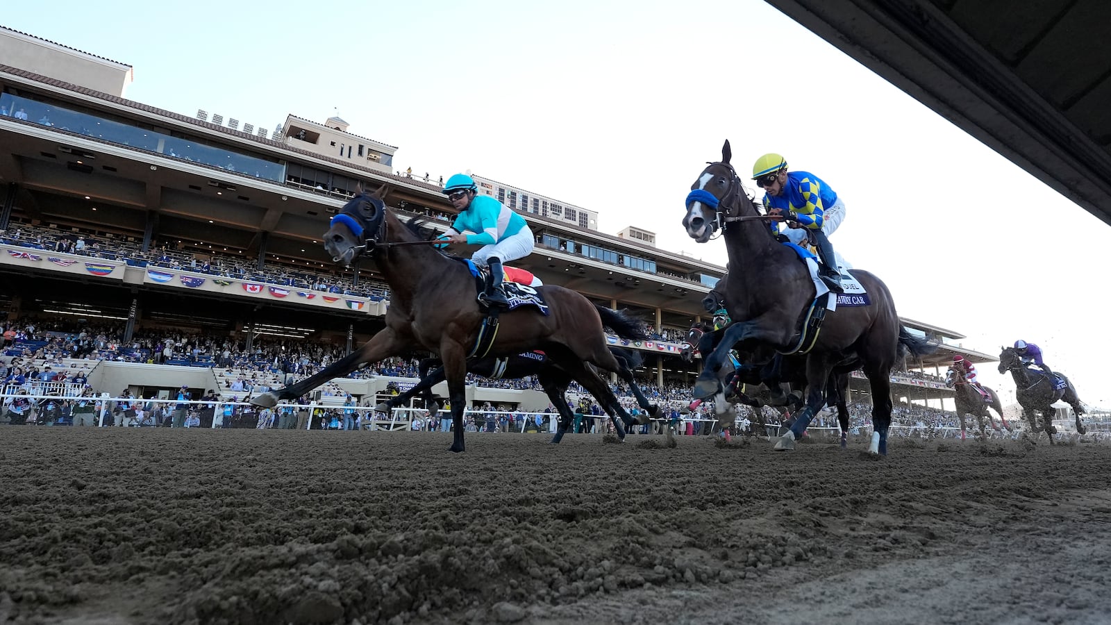 Martin Garcia rides Citizen Bull, left, to victory in the Breeders' Cup Juvenile horse race at Santa Anita Park in Del Mar, Calif., Friday, Nov. 1, 2024. (AP Photo/Gregory Bull)