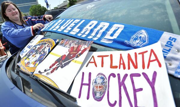 Thrashers fan Jennifer Peters decorates her car during an impromptu save-the-team rally outside Philips Arena in 2011.