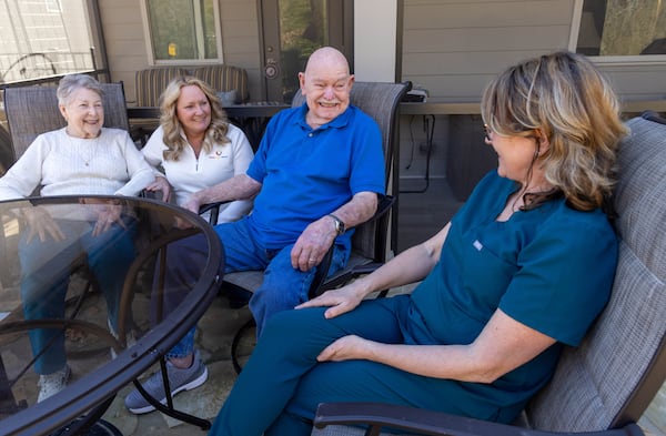 Ruth Renner (from left), Tina Boggs, Bill Renner and Beth Wilson have a special relationship. Wilson is a caregiver for the couple, helping with daily tasks, but she also assists with special occasions. PHIL SKINNER FOR THE ATLANTA JOURNAL-CONSTITUTION