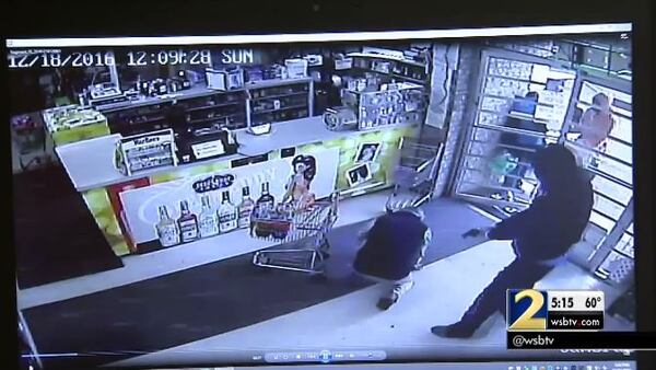 Police released surveillance footage from an armed robbery in Sandy Springs. (Credit: Channel 2 Action News)