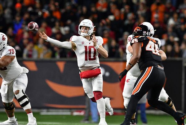 Washington State quarterback John Mateer (10) throws a pass against Oregon State during the first half of an NCAA college football game Saturday, Nov. 23, 2024, in Corvallis, Ore. (AP Photo/Mark Ylen)