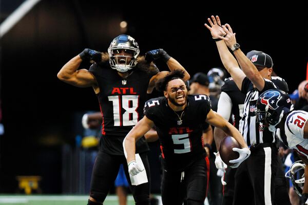 Atlanta Falcons receivers Drake London (5) and Mack Hollins (18) react after London’s catch during the second half on Sunday, October 8, 2023, at Mercedes-Benz Stadium in Atlanta. 
Miguel Martinz/miguel.martinezjimenez@ajc.com