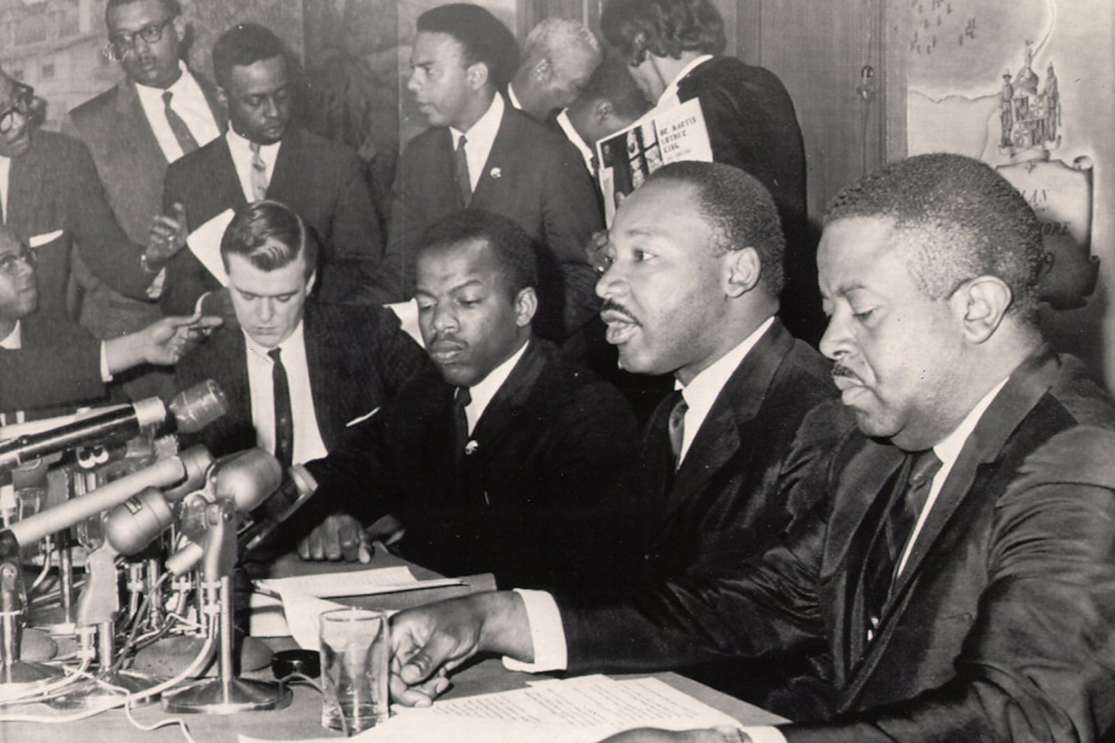 In 1963 at the age of 23, John Lewis became chairman of the Student Nonviolent Coordinating Committee, which worked alongside older civil rights groups such as Martin Luther King Jr.'s Southern Christian Leadership Conference. SNCC represented the younger vanguard of the movement and Lewis was the youngest member of what was dubbed "the Big Six" (Lewis, King, Roy Wilkins, Asa Philip Randolph, James Farmer Jr. and Whitney Young Jr.). In this photo from 1965, Lewis and King (along with Andrew Young in back and Ralph David Abernathy at right) announce an economic boycott of Alabama. The next year, Lewis would be replaced by Stokely Carmichael, who took SNCC in a more militant direction. (AP file)