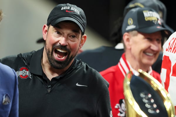 Ohio State head coach Ryan Day reacts after seeing the trophy following their 34-23 win against Notre Dame in the 2025 National Championship at Mercedes-Benz Stadium, Monday, Jan. 20, 2025, in Atlanta. (Jason Getz / AJC)