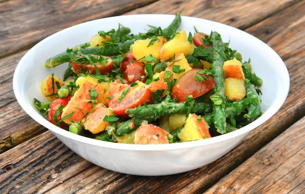 Parsley- and Basil-Infused Red Wine Vinegar adds a special touch to Herbed Potato, Green Bean, and Cherry Tomato Salad. STYLING BY NOELLE JOY / CONTRIBUTED BY CHRIS HUNT PHOTOGRAPHY