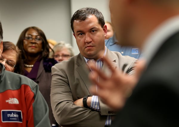 February 22, 2016 Cobb County: Jason Anavitarte, who volunteers for the Marco Rubio campaign, listens to a speaker during the opening of the campaign headquarters Monday evening February 26, 2016. Ben Gray / bgray@ajc.com