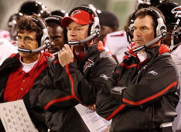 070810 EAST RUTHERFORD, N.J.: --Assistant coach defensive line Kevin Wolthausen, left, head coach Bobby Petrino, center, and defensive coordinator Mike Zimmer look on as the Jets make a drive during 2nd half action at the Meadowlands in East Rutherford, N.J., Friday, August 10, 2007.