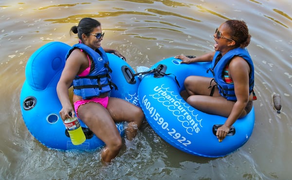 Candice Cobette (left) from Louisiana and Sherrie Jean from Tucker are shown in July 2012 tubing in the Chattahoochee River National Recreation Area in Sandy Springs. JOHN SPINK / JSPINK@AJC.COM