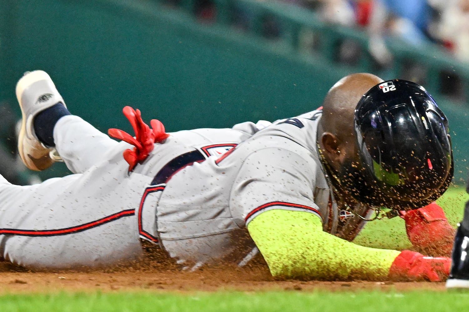 Atlanta Braves’ designated hitter Marcell Ozuna dives into third base after a single against the Philadelphia Phillies by Matt Olson during the ninth inning of NLDS Game 4 at Citizens Bank Park in Philadelphia on Thursday, Oct. 12, 2023.   (Hyosub Shin / Hyosub.Shin@ajc.com)