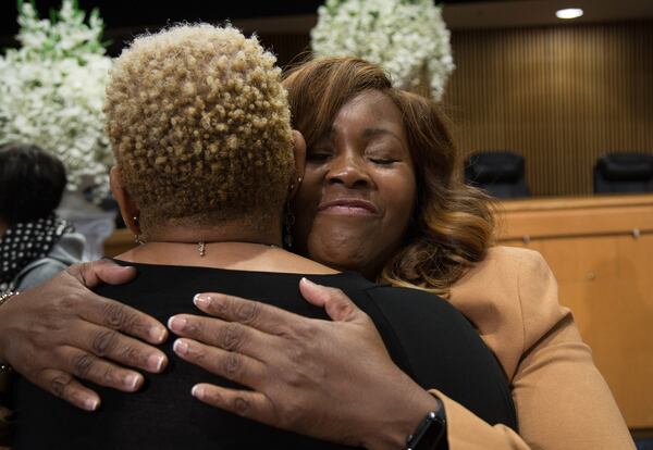 Marlene Fosque gets a hug from a supporter after her swearing-in ceremony at the Gwinnett Justice and Administration Center in Lawrenceville GA Friday 21, 2018. STEVE SCHAEFER / SPECIAL TO THE AJC