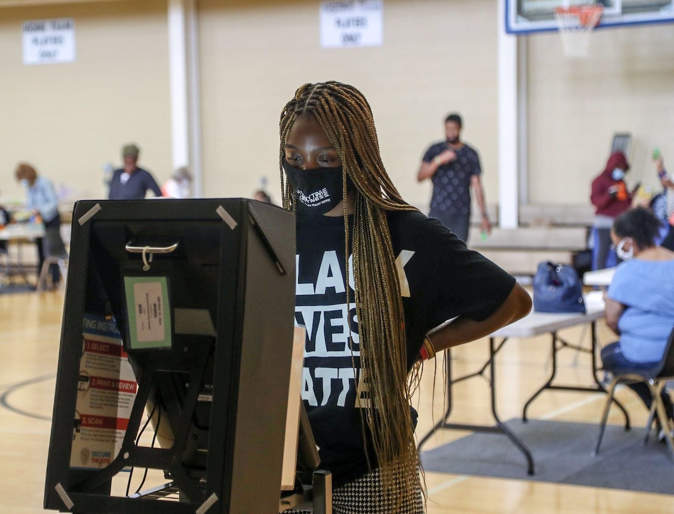 PHOTOS: Georgia voters struggle with long lines, new equipment, social distancing