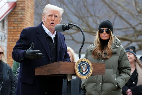 President Donald Trump, along side first lady Melania Trump, speaks as he meets with homeowners affected by Hurricane Helene in Swannanoa, N.C., Friday, Jan. 24, 2025. (AP Photo/Mark Schiefelbein)