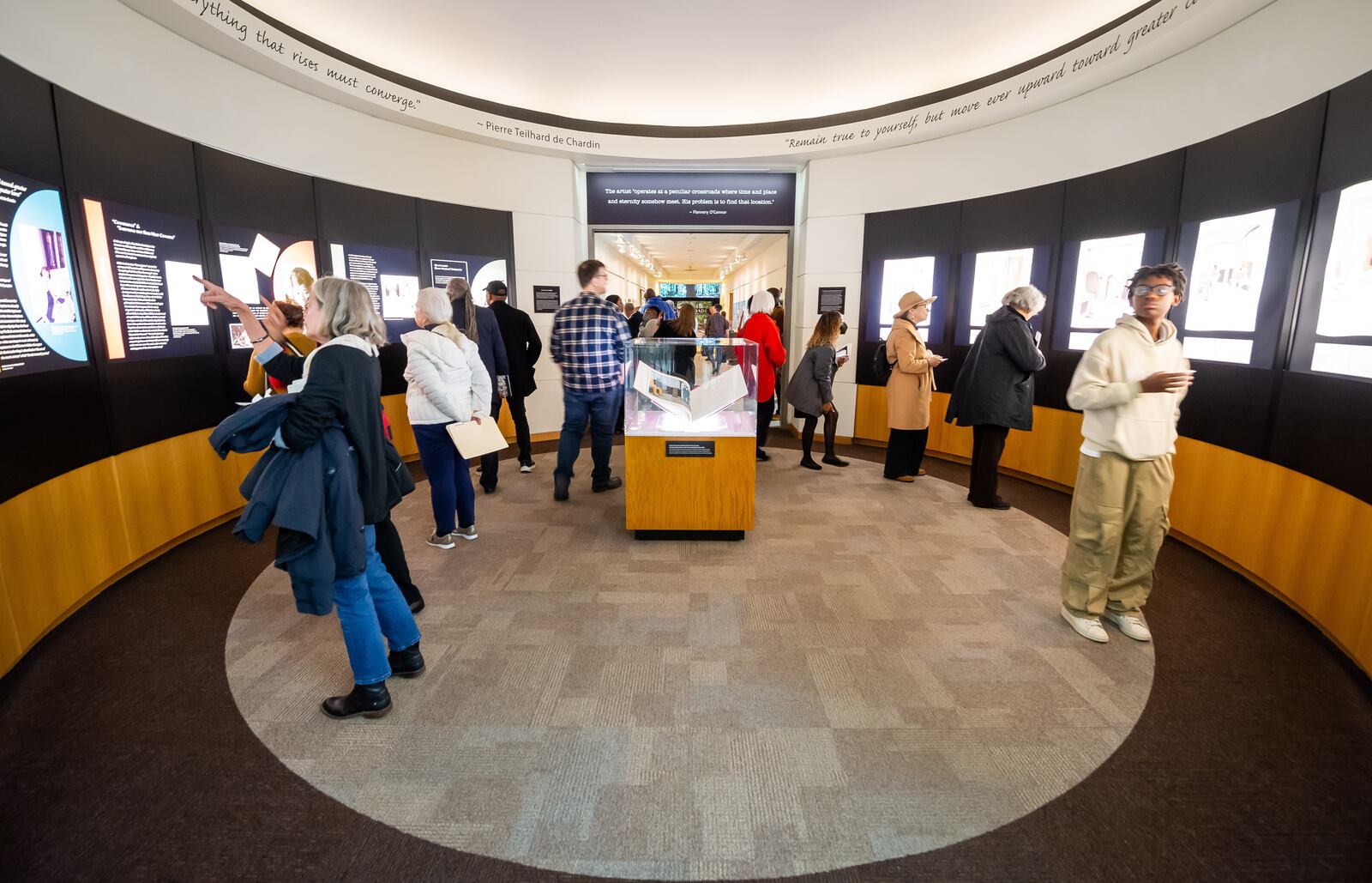 In the rotunda gallery of Emory's Schatten Gallery, visitors study the cultural connections between authors Flannery O'Connor and Alice Walker, and artist Benny Andrews, all of whom lived within 50 miles of one another in middle Georgia. (Photos by Bita Honarvar, Emory Libraries)