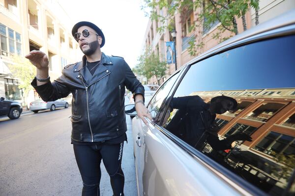 Christian Amaro recently left his car in the Atlantic Station parking garage and when he returned from shopping less than 40 minutes later, the right rear window was broken. (Miguel Martinez for The Atlanta Journal-Constitution)