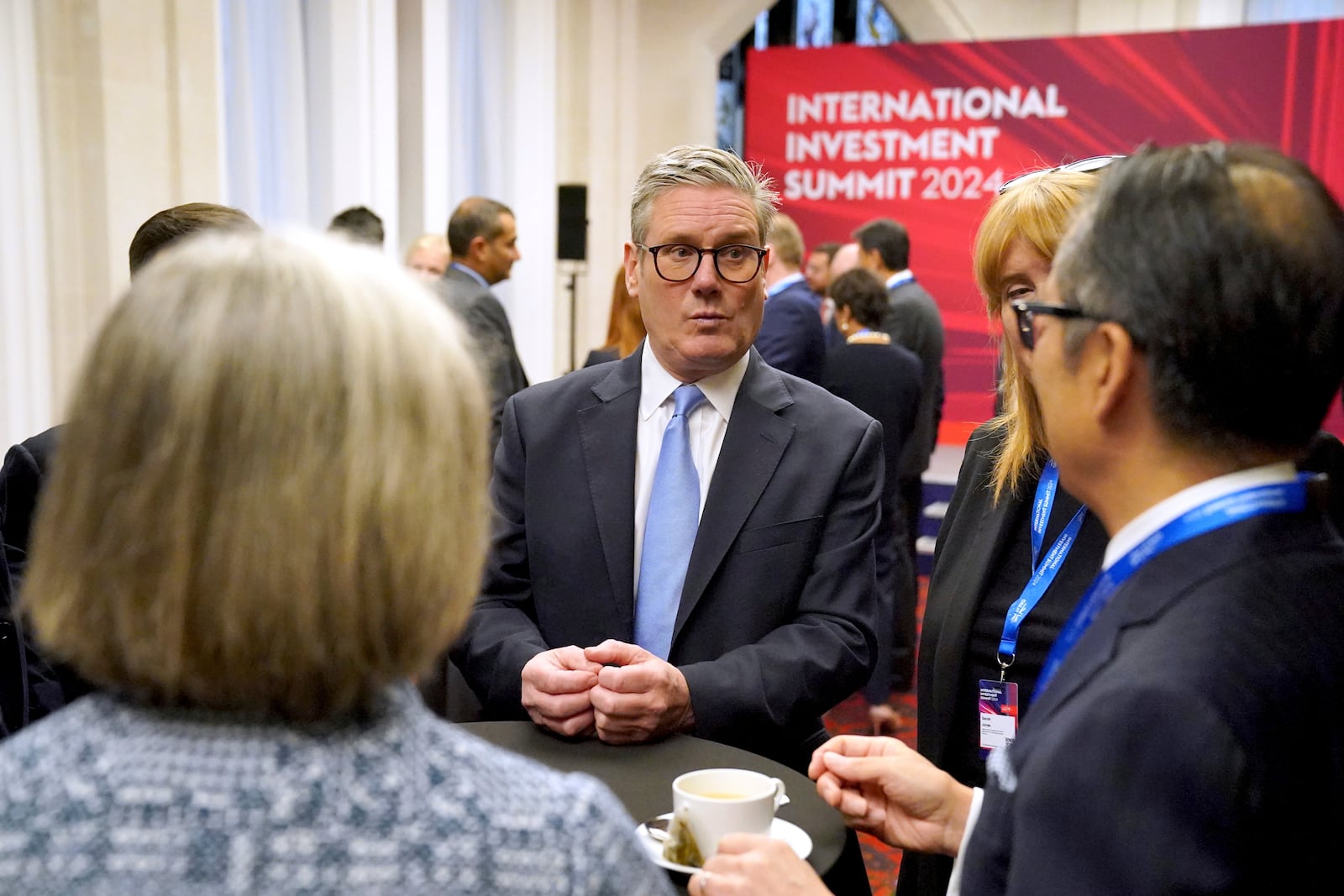 British Prime Minister Sir Keir Starmer, center, speaks with leaders from across the UK during the International Investment Summit in London, Monday, Oct. 14, 2024. (Jonathan Brady/Pool Photo via AP)