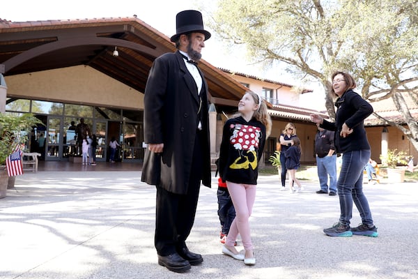 A man dressed as President Abraham Lincoln greeted visitors at the Ronald Reagan Presidential Library to mark Presidents Day in 2022 in Simi Valley, Calif. 