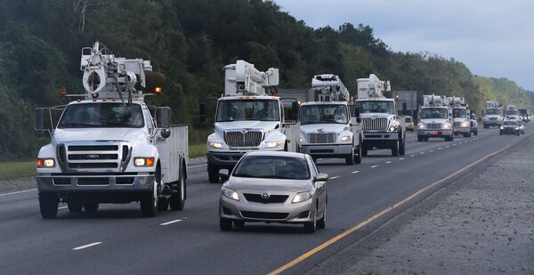 A fleet of power trucks head south on I-95 near Jesup to begin restoring power in the aftermath of Hurricane Matthew on Saturday, Oct. 8, 2016. Curtis Compton /ccompton@ajc.com