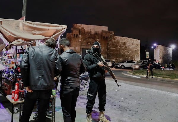 Members of the Syrian government security forces deploy at a street in Damascus, Syria, Thursday, March 6, 2025. (AP Photo/Omar Sanadiki)