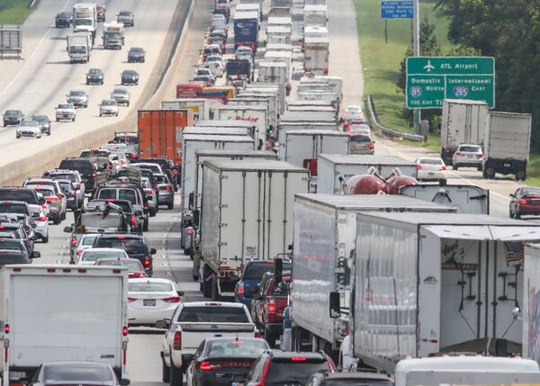 A state commission report is calling for Georgia to boost its annual spending road and rail improvements by $1.5 billion to better enable the transport of freight. JOHN SPINK /JSPINK@AJC.COM